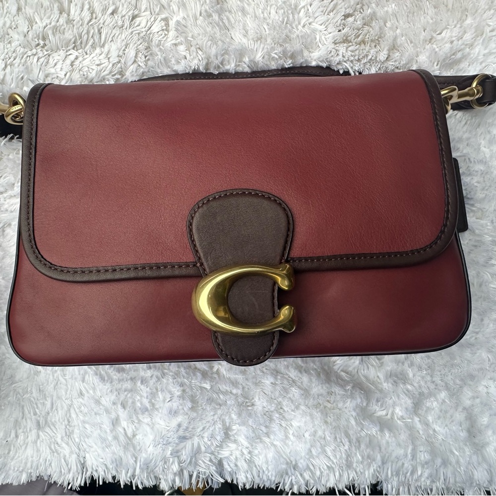 Burgundy Smooth leatherInside zip pocket Snap closure, fabric lining